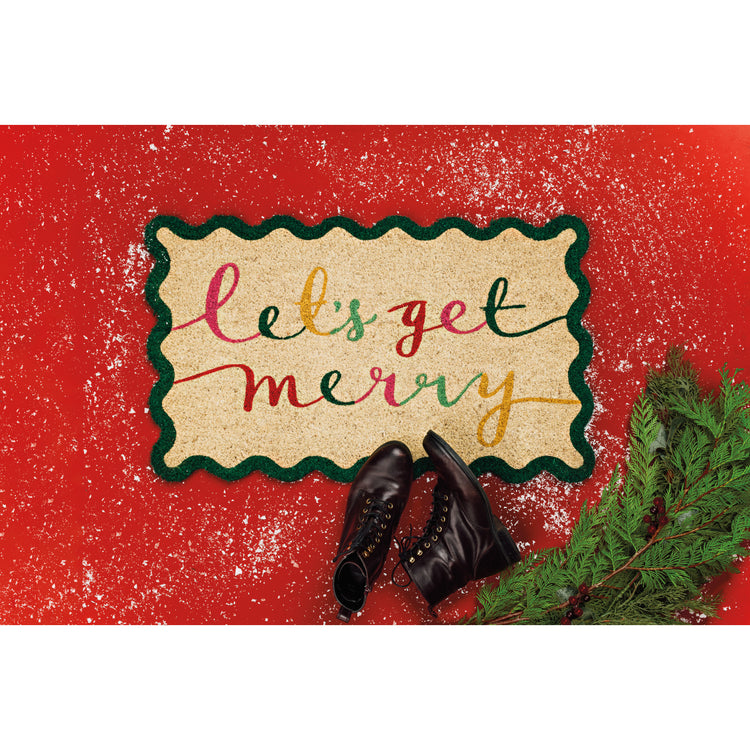 A Danica Jubilee shaped doormat with a scalloped edge from the Merry Everything Christmas collection that says Let's Get Merry in colorful cursive writing.