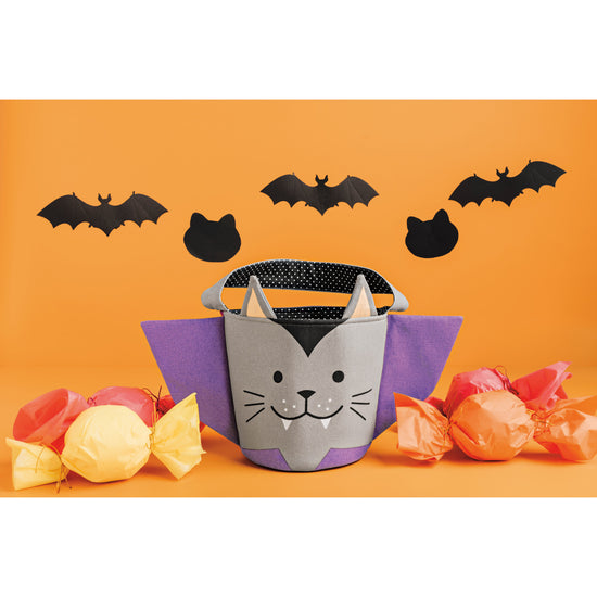 A Count Catula Halloween Candy Bucket by Danica Jubilee with black bats and cats on an orange background.